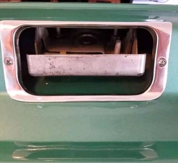 1973-1979 Ford "Dentside" Tailgate for sale. This tailgate is in very good driver shape and will be the perfect addition to your 73-79 Ford Pickup. The mech is complete and appears to be in perfect working shape. No dents. Some scratches due to normal use and wear, small surface rust on some scratches. Looks to be repainted to factory Jade Green Polly Metalic with hand painted Ford logos. You will be hard pressed to find another genuine Ford tailgate in the same condition, - Image 4