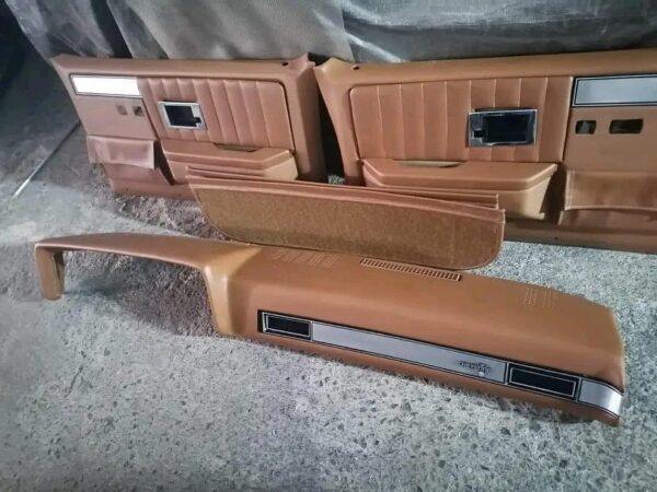 C10 interior “kit” . Custom shaped foam on a stock seat frame, stock door panels and dash pad all covered in relicate leather amber glow distressed leather.