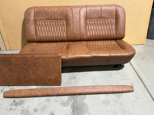 C10 interior “kit” . Custom shaped foam on a stock seat frame, stock door panels and dash pad all covered in relicate leather amber glow distressed leather. - Image 2